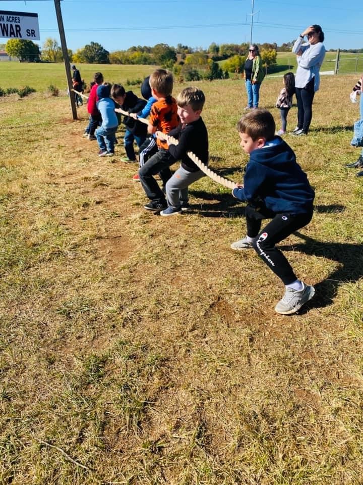 two teams play tug of war with a rope
