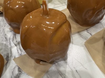 fresh dipped caramel apple on countertop