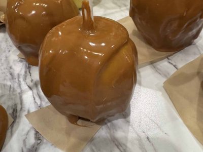 fresh dipped caramel apple on countertop