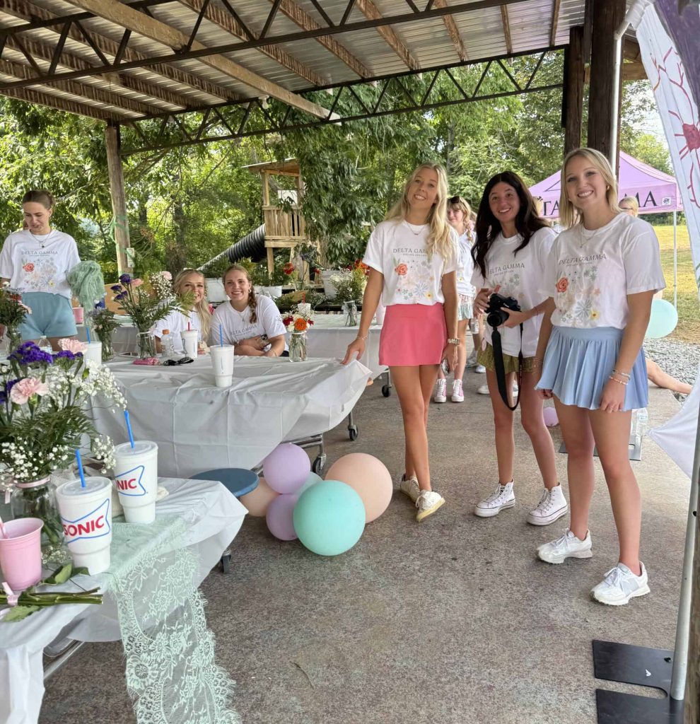 Group of women gathered for festivities in outside pavillion